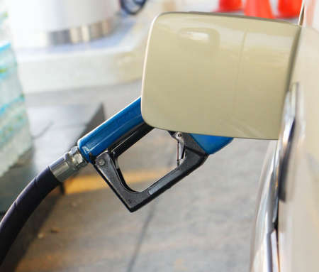 Putting gas in a car           の写真素材