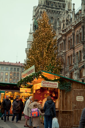 Christmas event in Munich: Christmas market in central Marien Platz and a very big Christmas tree in front of the City Hall.のeditorial素材