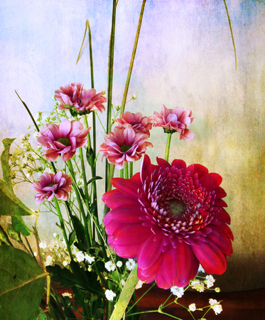 Bouquet of spring flowers on a retro and grunge textureの写真素材