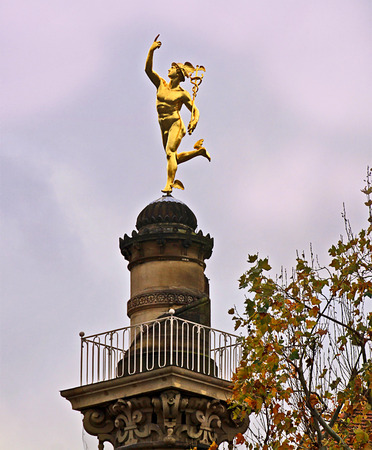 Stuttgart, Germany - golden Hermes statue on a column near Schlossplatzの写真素材