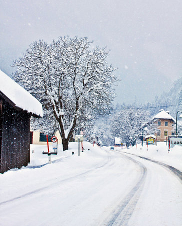 LAAS, AUSTRIA snow is falling on the Austrian Alpine route crossing Laas in Carinthia region.のeditorial素材