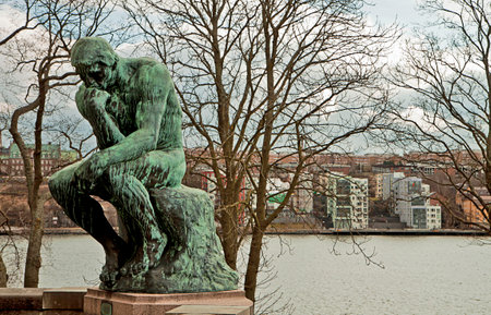STOCKHOLM SWEDEN  MARCH 28 2015. The Thinker by Rodin at Stockholm Waldemarsudde public garden. The statue one of the several around the world was commissioned by Prince Eugen to Rodin and delivered on 1908.It is possible to visit the former residence of のeditorial素材