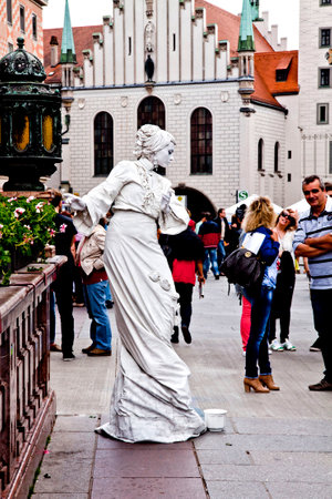 Munich, Germany - street artist painted in white performs in central Marienplatzのeditorial素材