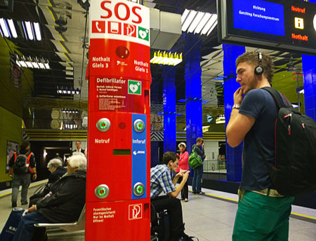 Munich, Germany - student reading the safety information at the SOS point at Muenchner Freiheit subway stationのeditorial素材