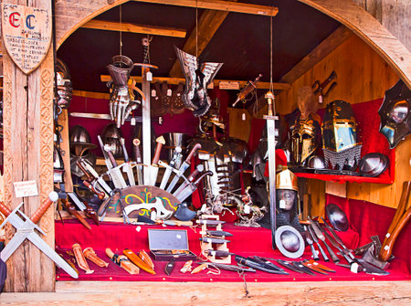 Munich, Germany - medieval stall at traditional Medieval Christmas market  Mittelaltermarkt at Wittelsbacher Platz in Munich.On sell knives, many kind of cutting weapon, helms  and armor piecesのeditorial素材