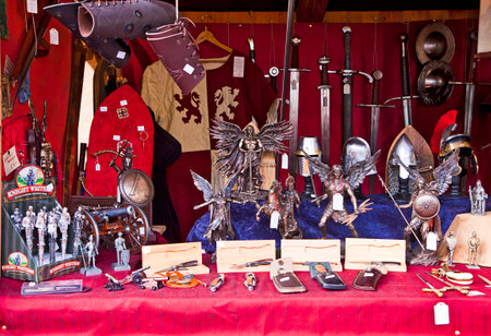 Munich, Germany -Stall at traditional Medieval Christmas market  Mittelaltermarkt at Wittelsbacher Platz in Munich.On sell medieval stuff, cutting weapon, metal figurines and souvenirのeditorial素材
