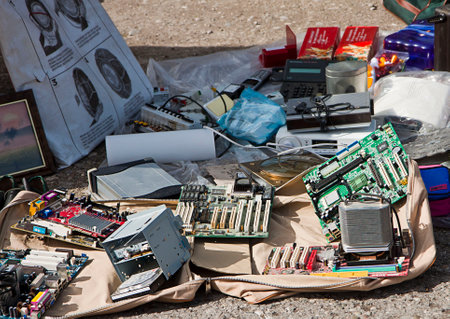 Vintage electronic  merchandise on display on the floor at open air flea market