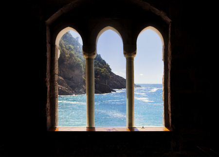 Beautiful view of Mediterranean sea from the window of a medieval abbey in Italyの写真素材