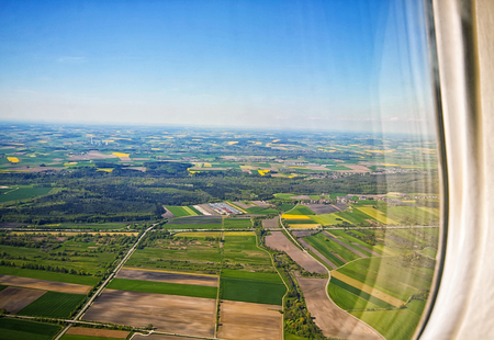 Beautiful aerial view of Bavarian countryside in springtime with clear weather and yellow canola...