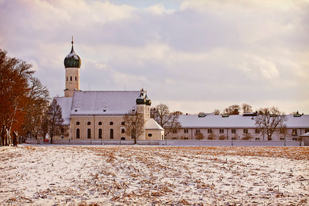 Winter Bavarian landscape with snow and church at sunset with the characteristic baroque onion domesのeditorial素材