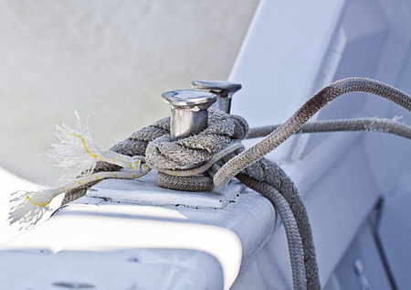 Sailboat detail, metal cleats with rope turned aroundの写真素材