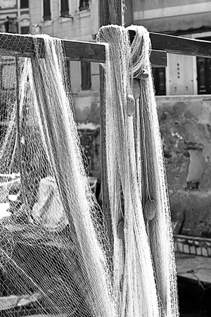 fishing nets sprawled out to dry in the sun in the harbor of Camogli, Italy, village fisher on the Ligurian coastの写真素材