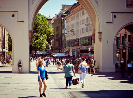 hot weather in Munich, more than 30 Celsius, people stroll in city center near Karsltor at...
