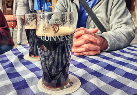 Enjoy late autumnal warm weather, sitting outside with a beerのeditorial素材