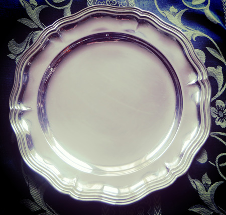 Beautiful shiny silver plate in classical styleの写真素材
