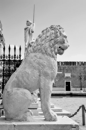 VENICE, ITALY - MARCH 31, 2010, white marble carved lion, symbol of Venice, in front of the Arsenal entrance, the antique shipyard of the cityのeditorial素材