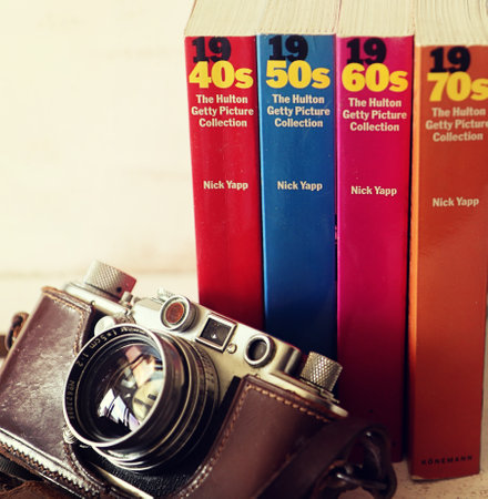 Vintage Leica camera and books with the Hulton Getty picture collection of analog images...