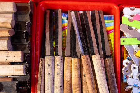 This stock photo shows a large, handmade knife displayed on a wooden block.の写真素材