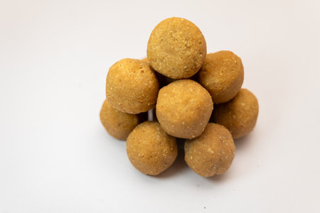 This image is about Nice Crushed Peanut Chikki Ball in White Background Stock Photoの写真素材