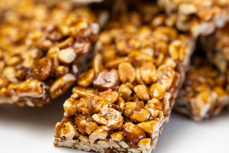 A close-up of a healthy breakfast dish with fresh chikki peanut for an energizing snack or sweet meal.の写真素材