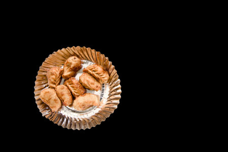 Delicious fried momos arranged on a black backdrop, perfect for food lovers.の写真素材