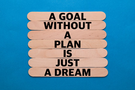 Motivational message spelled out on wooden sticks against vibrant blue, reminding us to turn...