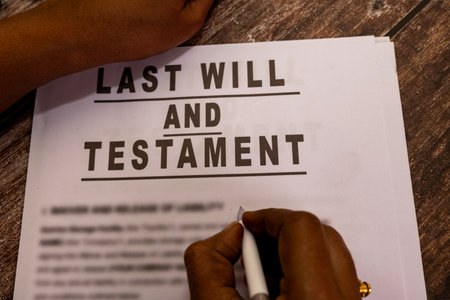 Signing a last will and testament document.  Planning for the future and estate distribution.の写真素材