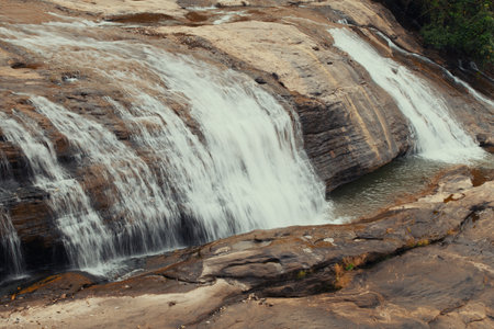 Waterfall in the forest brown rockの写真素材