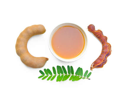 Tamarind and tamarind juice on white backgroundの写真素材