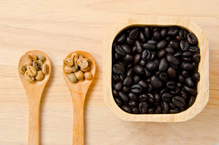 different types of Coffee beans on wooden spoons and cupの写真素材
