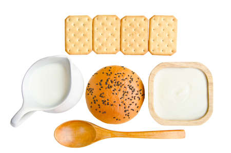 Whole wheat bread and biscuits in breakfast set on white backgroundの写真素材