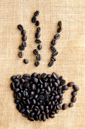 coffee grains on sack background