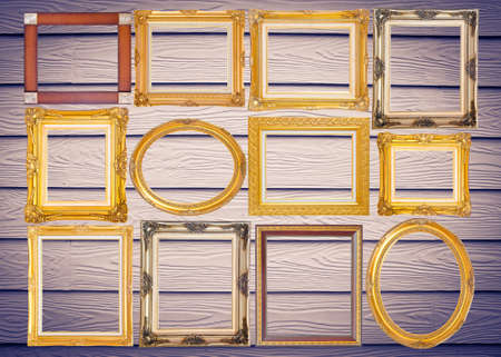 Set of golden vintage frame on wooden background