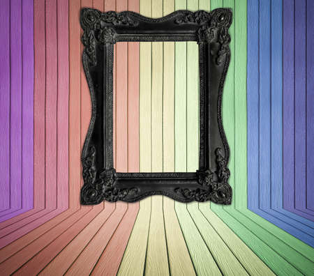 Black old frame in colorful wood room backgroundの写真素材
