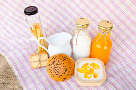 Whole wheat bread and biscuits in breakfast setの写真素材