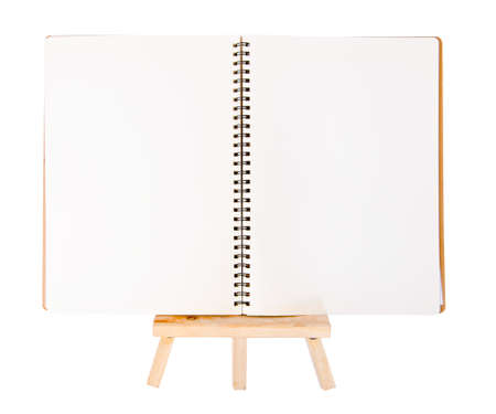 open diary ring binder on small tripod for painting. isolated on white backgroundの写真素材