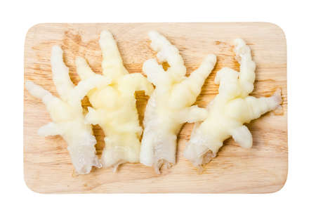 Skin foot of chicken no bone on wooden.の写真素材