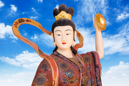 Chinese God on blue sky background in chinese Tample , Thailandの写真素材