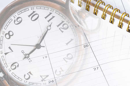 sheet of a calendar and diary with the number of days and clock close-up