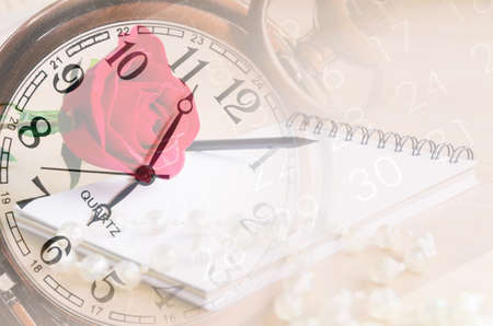 vintage clock fade on red rose, diary and number on calendar background. Memory concept.の写真素材