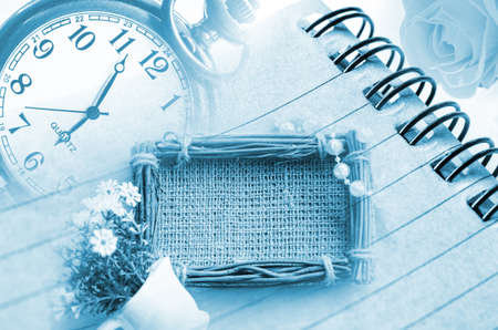 Vintage clock and diary with sack photo frame.Time and memory concept
