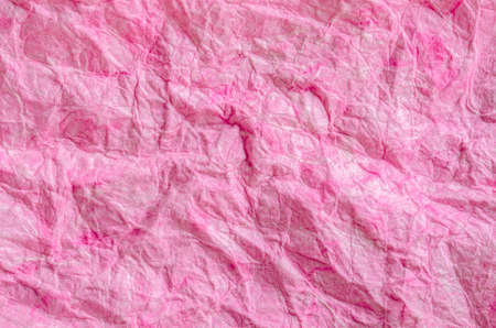 Pink paper background with fiber structure. Recycle paper.の写真素材