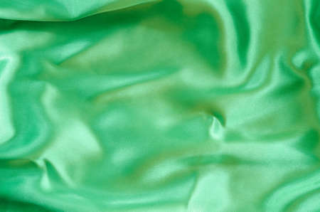 Emerald or green silk fabric texture or backgroundの写真素材