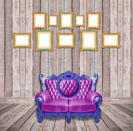 Luxurious armchair and vintage frame in wooden room.の写真素材