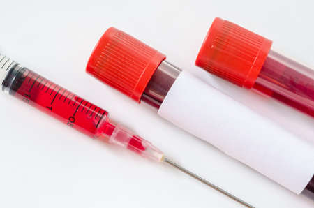 Syringe And Plastic Test Tube With Blood Isolated on Whiteの写真素材