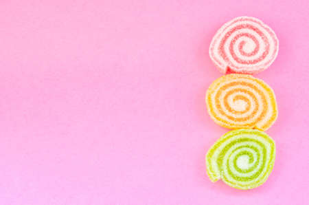 Jelly sweet, flavor fruit, candy dessert colorful with copy space on pink background.の写真素材