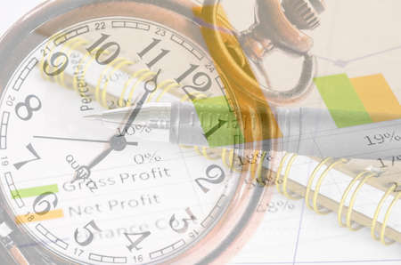Clock and market report graph with document. Business time concept.の写真素材
