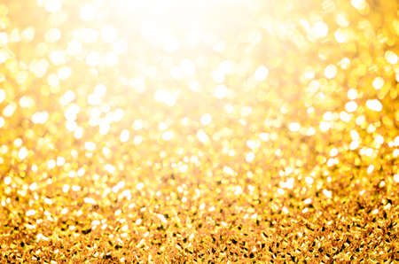 Abstract bokeh gold lighting backgroundの写真素材