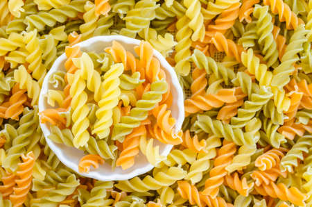 Three Colors Rotini Pasta in white bowl.の写真素材