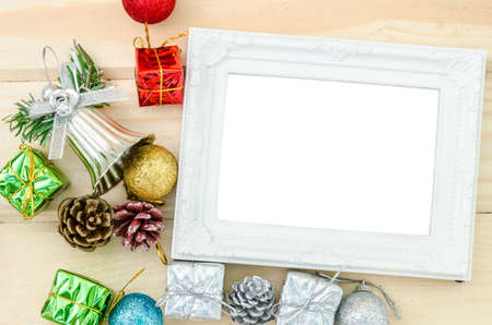 Vintage photo frame and christmas decorations on wood background. の写真素材